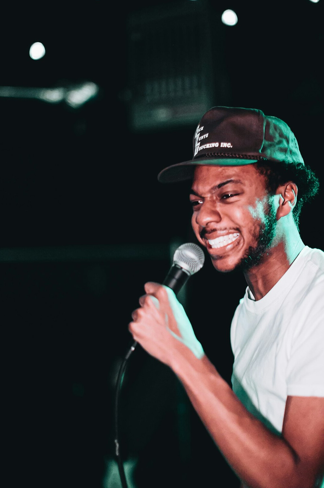 young man singing with microphone
