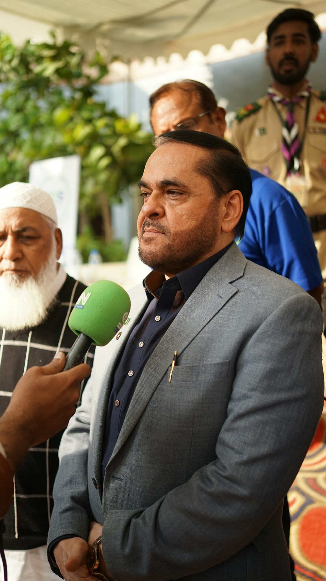 minister in suit at press conference
