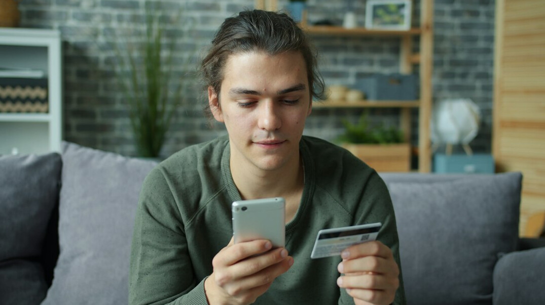 Danish woman reviewing household finances at her kitchen table